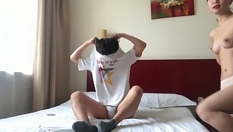 A Pair Of Chinese Lovers Engage In Intimacy In A Hotel Suite